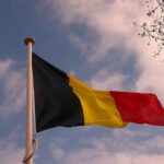 Belgian flag against a blue sky